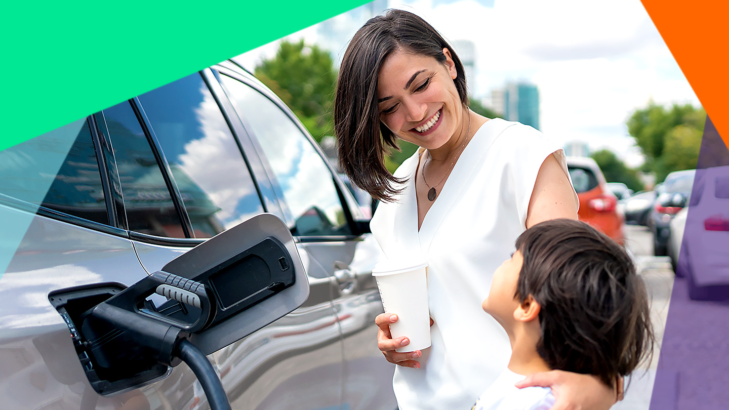 mother and child pumping gas together