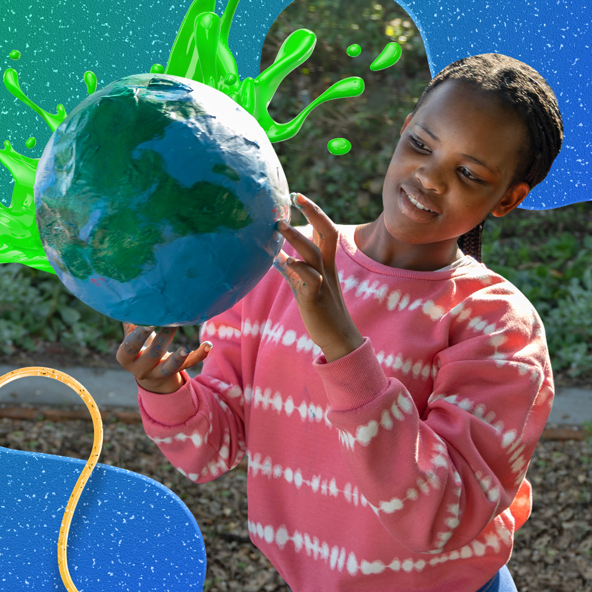 A young black girl wearing a striped white and red sweater poses with a globe.